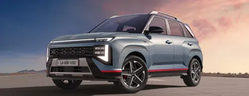 Close-up profile of a gray Hyundai Venue N Line with red accents on the bumper and side skirts.